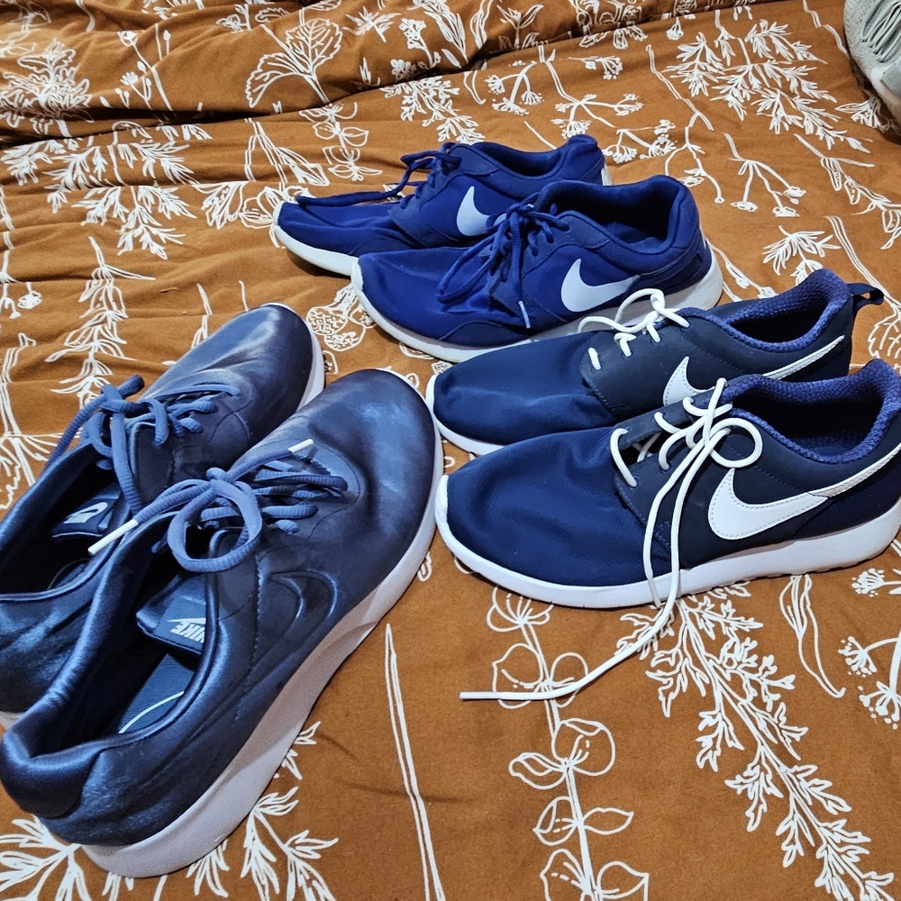 3 blue Nike runners